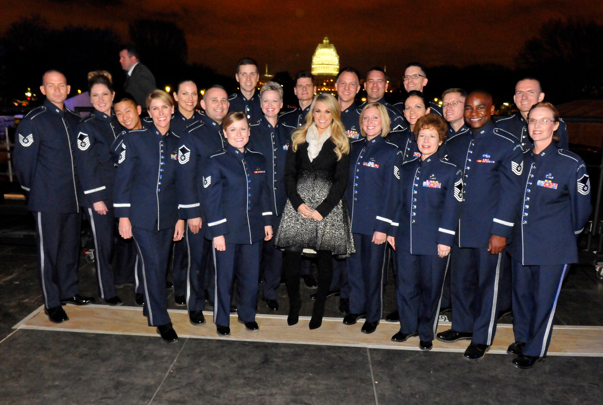 Members of the Singing Sergeants pose with Carrie Underwood backstage during "The Concert for Valor," which was held in Washington, D.C., on Nov. 11. (Photo by Eric Ritter/released)