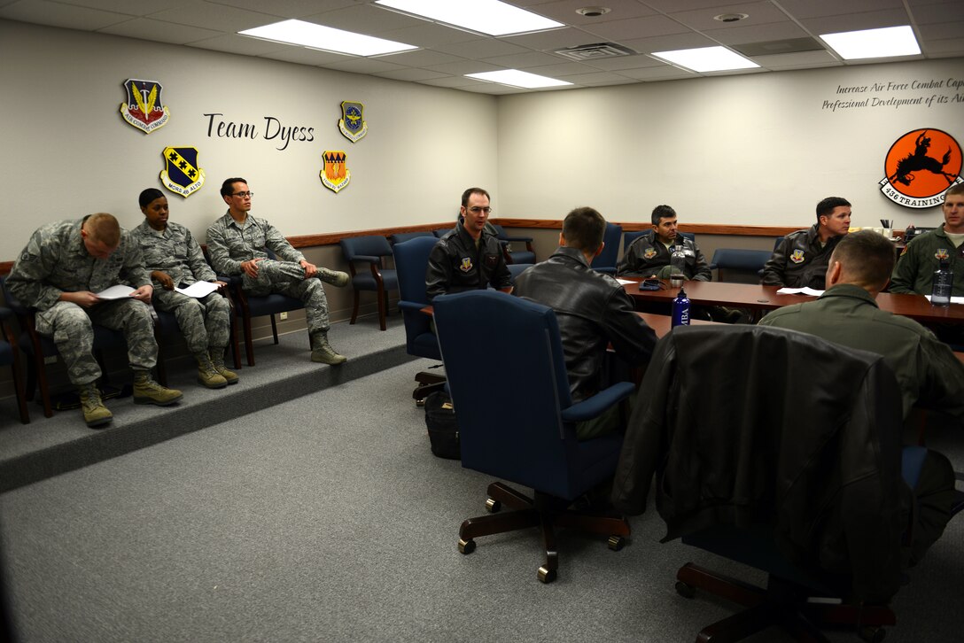 Airmen assigned to the 28th Bomb Squadron await a virtual teleconference briefing for a Razor Talon exercise Nov. 13, 2014, at Dyess Air Force Base, Texas. Several briefs were conducted to plan the mission, which included participants from Seymour Johnson Air Force Base, N.C., Langley Air Force Base, Va., and Shaw Air Force Base, S.C. The units remained geographically separated in the planning phases, which provided cost savings compared to other large-force integration exercises. (U.S. Air Force photo by Airman 1st Class Kedesha Pennant/Released)