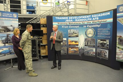 Kevin Haley (right), 502nd Trainer Development Squadron civilian leader, briefs Gen. Robin Rand, commander of Air Education and Training Command, and his wife, Kim Rand, Nov. 20 on the TDS mission at Joint Base San Antonio-Randolph. (U.S. Air Force photo by Joel Martinez)

