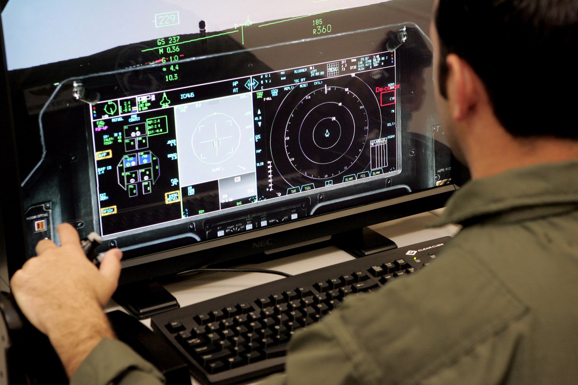 An Airman practices on an F-35 Lightning II pilot training aid at the 33rd Fighter Wing’s F-35 Academic Training Center on Eglin Air Force Base, Fla., Nov. 22, 2013. The pilot and maintainer qualifications are accomplished through simulations to ensure efficient mission readiness. As the first of its kind in the Department of Defense, the wing is responsible for F-35 Lightning II pilot and maintainer training for the DOD and, in the future, at least eight coalition partners. (U.S. Air Force courtesy photo)