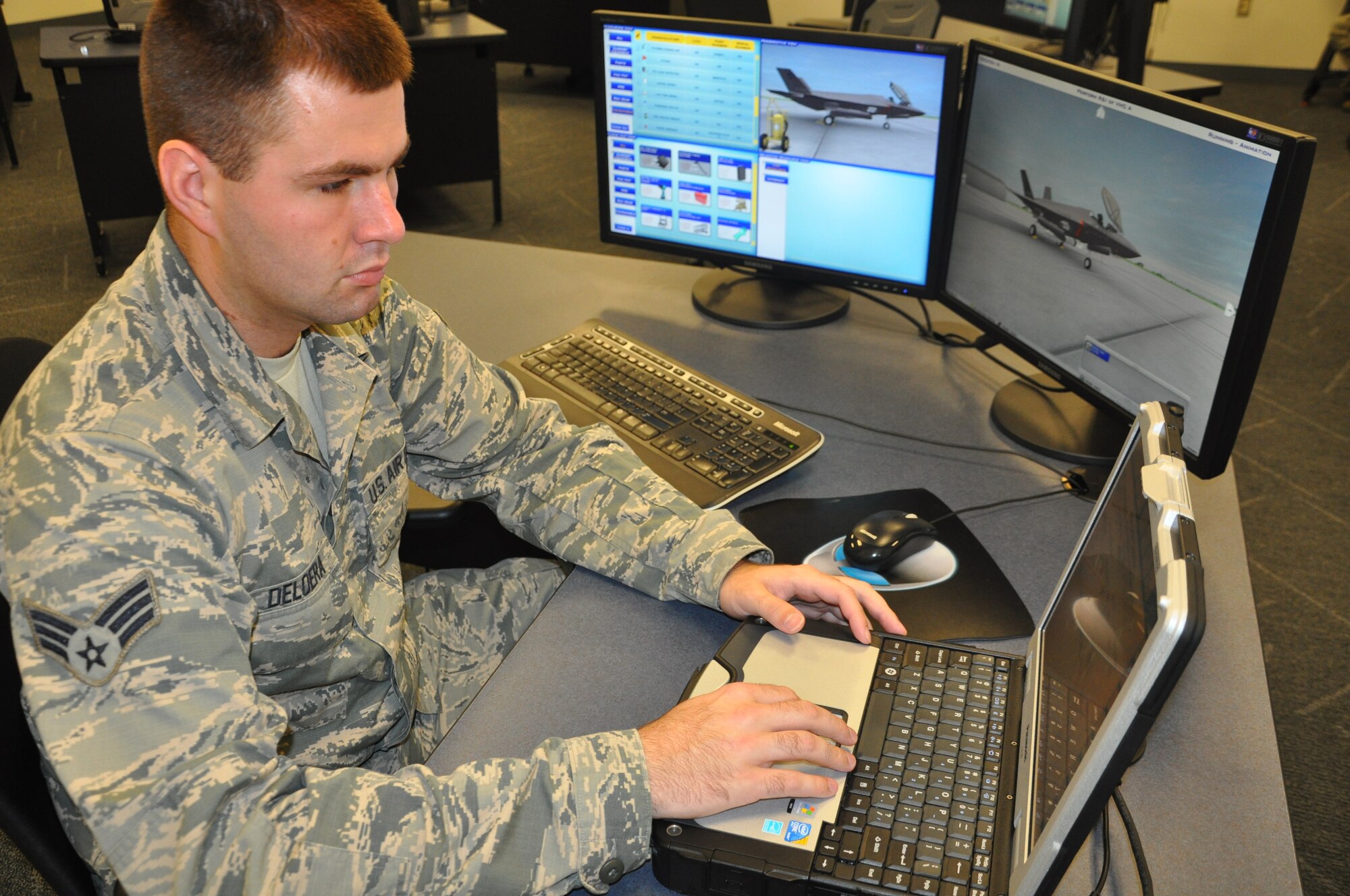 Senior Airman David Deloera from Nellis Air Force Base, Utah, practices on an aircraft systems maintenance trainer at the 33rd Fighter Wing’s F-35 Lightning II Academic Training Center on Eglin Air Force Base, Fla., Sept. 9, 2012. The pilot and maintainer qualifications are accomplished through simulations to ensure efficient mission readiness. As the first of its kind in the Department of Defense, the wing is responsible for F-35 Lightning II pilot and maintainer training for the DOD and, in the future, at least eight coalition partners. (U.S. Air Force courtesy photo)