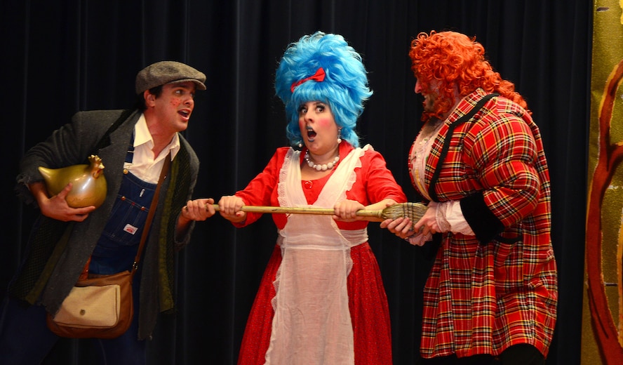 VANCE AIR FORCE BASE, Okla. -- Pedro Willis-Barbosa, left, a Tulsa Opera tenor vocalist, Elizabeth Kelsay, center, a Tulsa Opera soprano vocalist, and Tim Petty, right, Tula Opera bass vocalist, struggle over a broomstick during an opera adaptation of “Jack and the Beanstalk” at Eisenhower Elementary School, Nov. 17. The Tulsa Opera performers visited the school as part of an outreach program to give children a taste of the performing arts. (U.S. Air Force photo/Senior Airman Frank Casciotta)