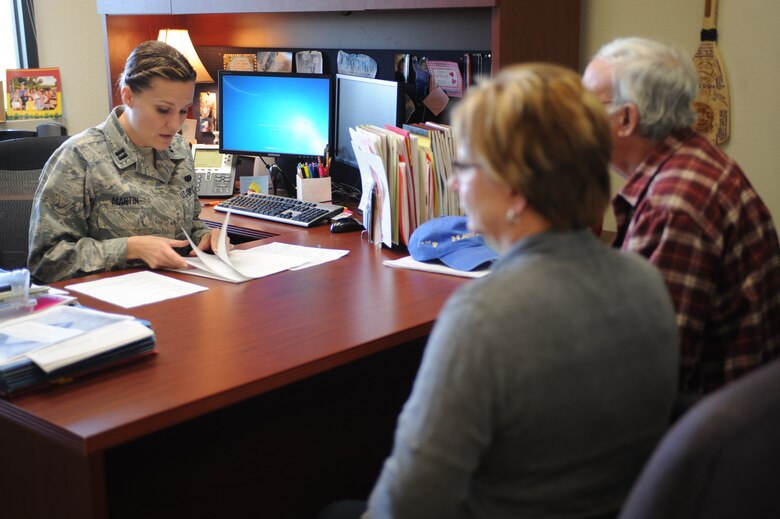 U.S. Air Force Capt. Kathryn Martin, 355th Fighter Wing attorney, reviews a will prior to it being finalized on Davis-Monthan Air Force, Ariz., Nov. 19, 2014. After an increase in demand for wills in the D-M area was recognized, the legal office increased their retiree will nights from quarterly to monthly. (U.S. Air Force photo by Staff Sgt. Courtney Richardson)