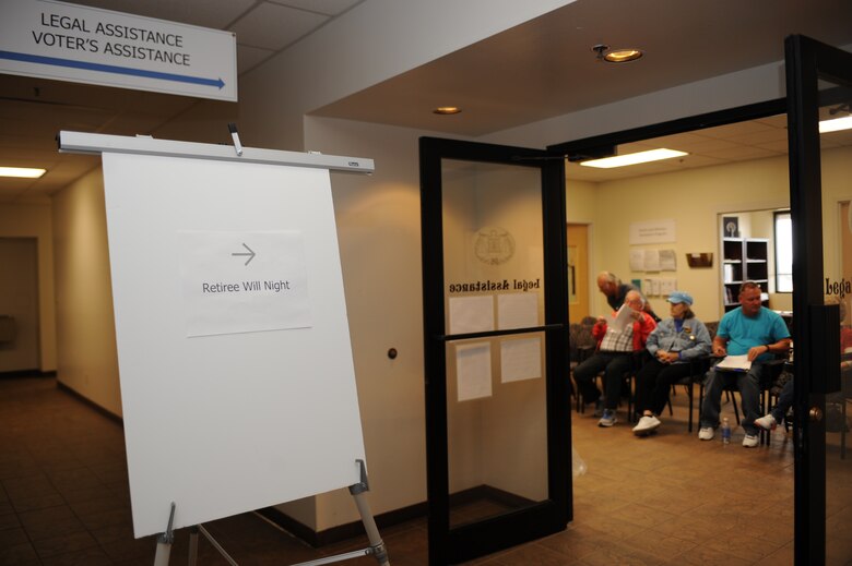 Retirees wait in the 355th Legal Office during Retiree Will Night at Davis-Monthan Air Force Base, Ariz., Nov. 19, 2014. The legal office has increased their will writing availability by offering the service monthly. (U.S. Air Force photo by Staff Sgt. Courtney Richardson)