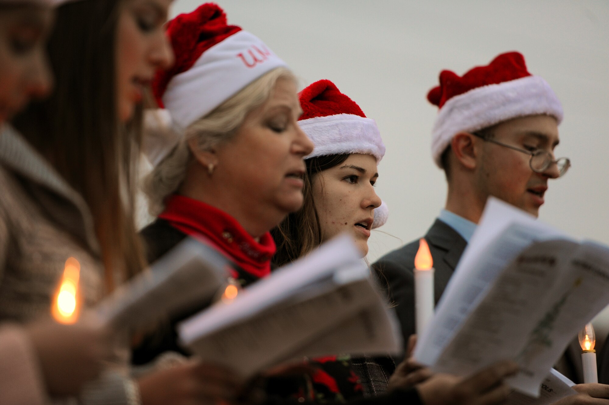 GOODFELLOW AIR FORCE BASE, Texas – Carolers sing songs during the tree lighting ceremony near the Taylor Chapel Dec. 2. The Taylor Chapel-hosted ceremony included caroling, the lighting of the Holiday Tree and a Santa Claus visit. (U.S. Air Force photo/ Airman 1st Class Devin Boyer)