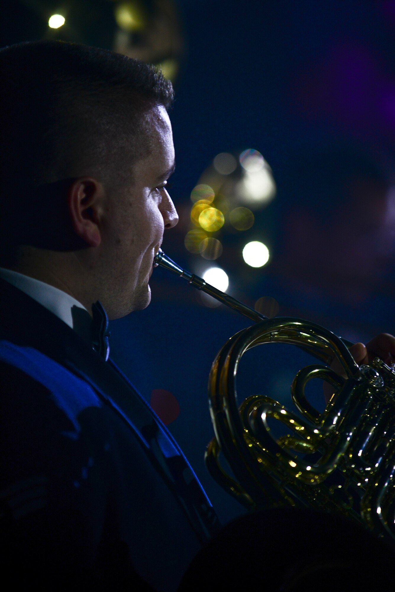 U.S. Air Force Senior Airman Dan Omer, U.S. Air Force Heritage of America Band French horn player, plays during the bands “Through Children’s Eyes” holiday concert at Jamestown High School in Williamsburg, Va., Dec. 2, 2014. Omer is part of the Langley Winds, Concert Band and Ceremonial Band ensembles. (U.S. Air Force photo by Senior Airman Kimberly Nagle/Released)