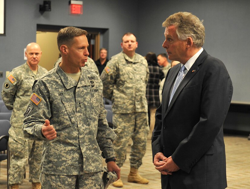 U.S. Army Maj. Gen. William Roy, Joint Task Force Civil Support commander, discusses the unit mission with Terry McAuliffe, Virginia governor, during the governor's first visit to the JTF-CS headquarters building at Fort Eustis, Va., Dec. 2, 2014. The purpose of the visit was for McAuliffe to learn about the JTF-CS employment concept and the defense chemical, biological, radiological and nuclear response force. (Official Department of Defense photo by Navy Petty Officer 1st Class Brian Dietrick/Released)