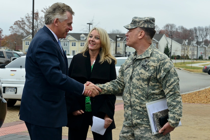 Terry McAuliffe, Virginia governor, is greeted by U.S. Army Col. William Galbraith, 733rd Mission Support Group commander, and Sheila Hairr, Training and Doctrine Command protocol chief, during his visit to Fort Eustis, Va., Dec. 2, 2014. During the visit, the governor learned about the installation’s various missions. (U.S. Air Force photo by Senior Airman Kimberly Nagle/Released)