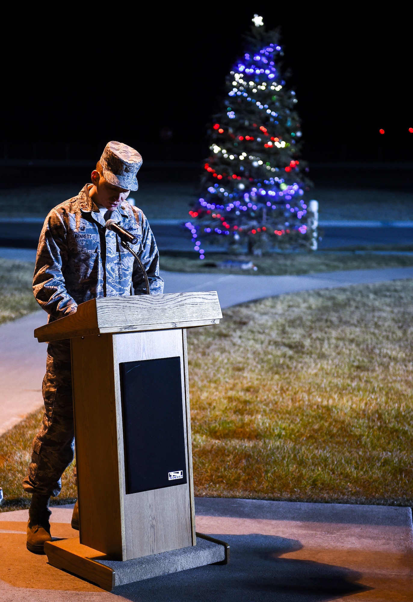 Maj. Christopher Kennedy, 460th Space Communications Squadron commander, speaks to the crowd during a tree-lighting ceremony Dec. 2, 2014, on Buckley Air Force Base, Colo. The ceremony honored Senior Airman Kristopher Mansfield and Senior Airman Michael Snyder, both members of the 460th Space Communications Squadron who were killed by drunk drivers. (U.S. Air Force photo by Senior Airman Riley Johnson/Released)