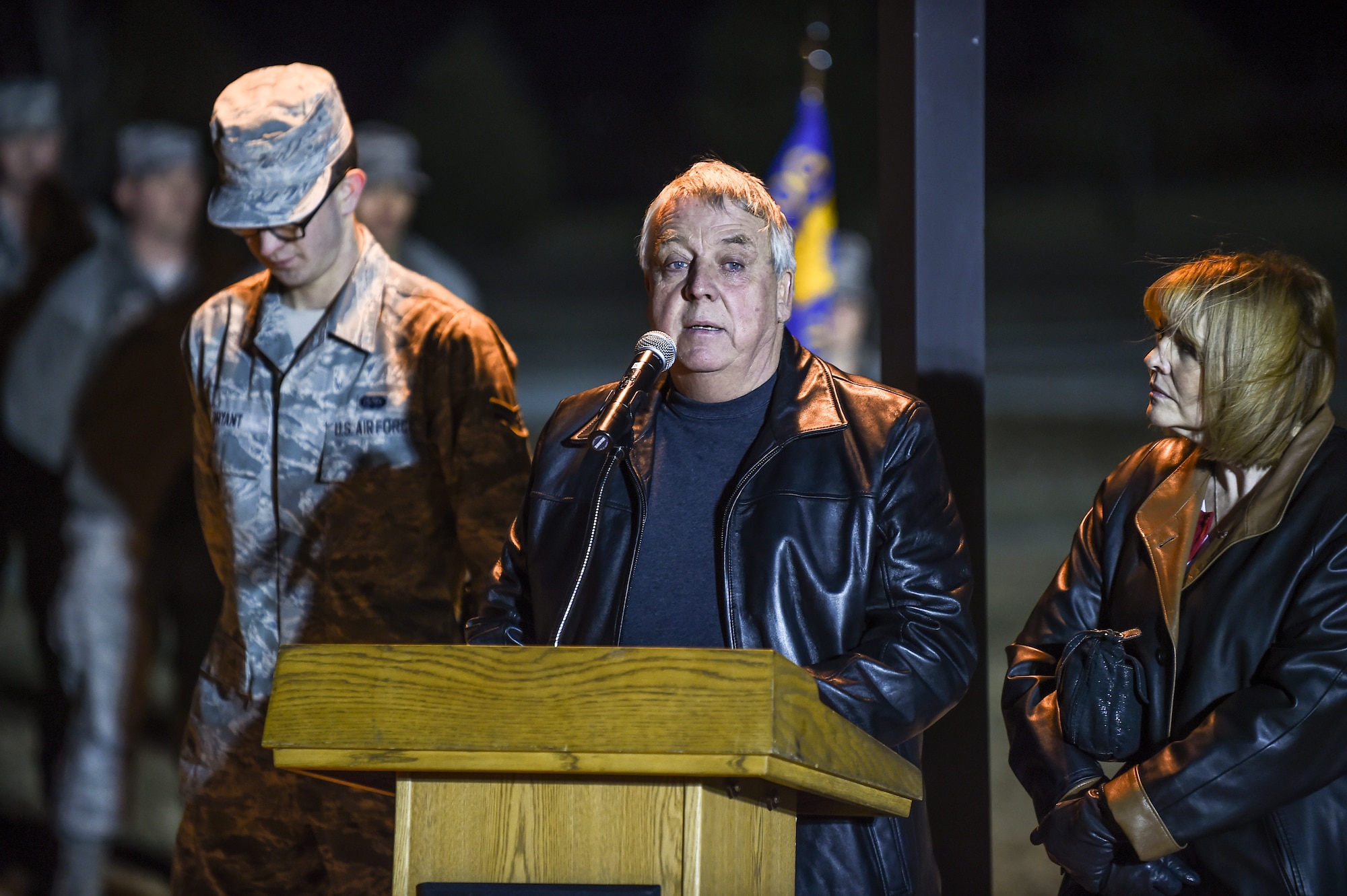 Craig Mansfield, father of the late Senior Airman Kristopher Mansfield, speaks about his son during a tree-lighting ceremony Dec. 2, 2014, on Buckley Air Force Base, Colo. The ceremony honored Kristopher and Senior Airman Michael Snyder, both members of the 460th Space Communications Squadron who were killed by drunk drivers. (U.S. Air Force photo by Senior Airman Riley Johnson/Released)