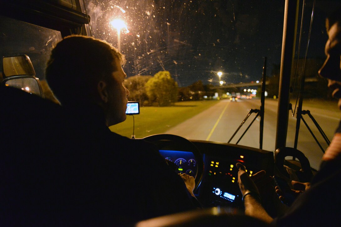 Senior Airman Mark Roberts, 633rd Logistics Readiness Squadron Vehicle Operations apprentice, drives to Keesler Air Force Base, Miss., Oct. 31, 2014. During long drives, another Tops in Blue member will converse with Roberts to distract him from the monotony of driving.  (U.S. Air Force photo by Airman 1st Class Jimmie D. Pike)(Released)