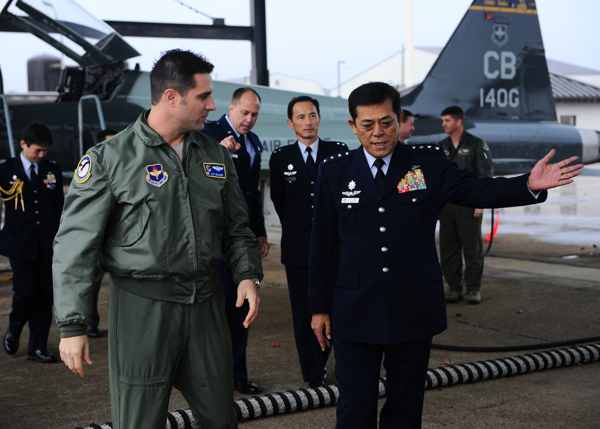 Columbus Air Force Base pilots display the T-38C Talon and the T-6A Texan II to Gen. Harukazu Saitoh, Japan Air Self-Defense Force Chief of Staff, and JASDF staff during their base tour Dec. 2 on the Columbus Air Force Base flightline. The JASDF’s pilot training in the U.S. Air Force began in 1991. Since then, over 200 JASDF pilots have completed the training. (U.S. Air Force photo/Airman Daniel Lile)