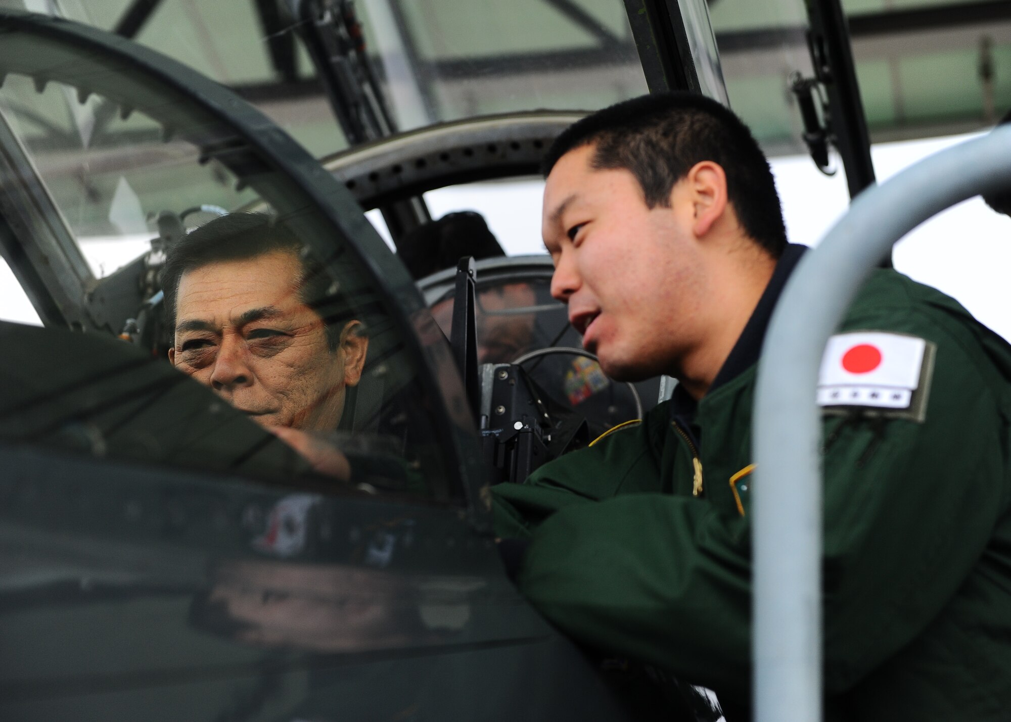 First Lt. Fumita Sakyu, 49th Fighter Training Squadron, points out the Up Front control panel, where pilots control their avionics, to include radios and navigational aids, to Gen. Harukazu Saitoh, Japan Air Self-Defense Force Chief of Staff, in a T-38C Talon during his tour Dec. 2 on Columbus Air Force Base. Saitoh said the training the JASDF pilots go through significantly contributes to strengthening the U.S.-Japan alliance. (U.S. Air Force photo/Airman Daniel Lile)