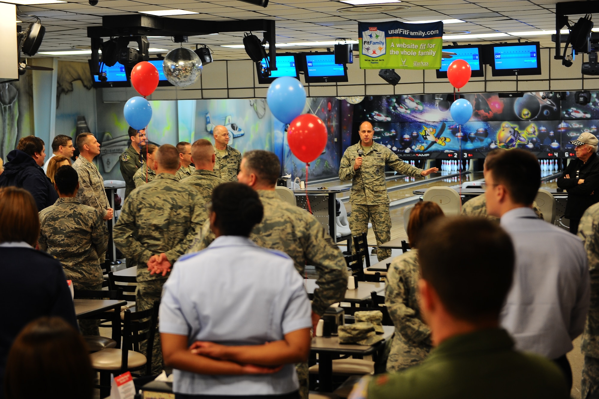 Col. John Nichols, 14th Flying Training Wing Commander, addresses the crowd at the Bowling Center, Strike Zone Lanes, grand re-opening Dec. 1. Strike Zone Lanes, was temporarily closed for quality of life changes but reopened with brand-new paint, rental equipment, and a new more “grill oriented” menu. (U.S. Air Force photo/Airman Daniel Lile)
