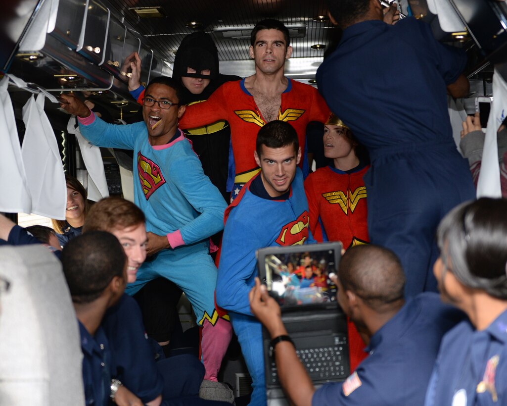 “They didn’t have a men’s section...” Members dressed in super hero costumes pose for a photo Oct. 31, 2014 on the road to Keesler, Miss. Tops in Blue travels with about 40 members, most of them traveling in close quarters for the entirety of the tour. Members find ways to bond and laugh to keep morale high and stress low. (U.S. Air Force photo by Airman 1st Class Jimmie D. Pike)(Released)