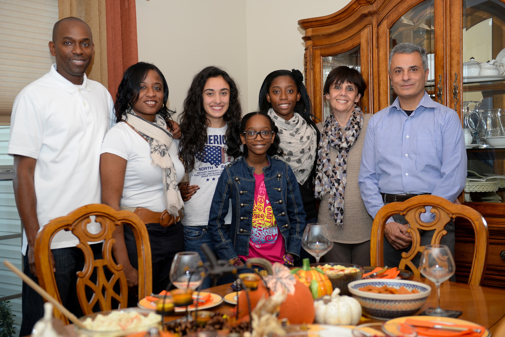 The McBride's and the Barbieri's celebrate Thanksgiving together after the Barbieri's came from Italy to visit their daughter Francesca, O'Fallon, Ill., Nov. 27, 2014. Francesca Barbieri is an Italian exchange student living with the McBride's since August 2013, and now attends Southern Illinois University at Edwardsville, studying Business Administration and Chinese Mandarin. Master Sgt. Anton McBride and his wife, Carmen, host and provide for Barbieri as if she was their own daughter. (U.S. Air Force photo by Airman 1st Class Erica Crossen)