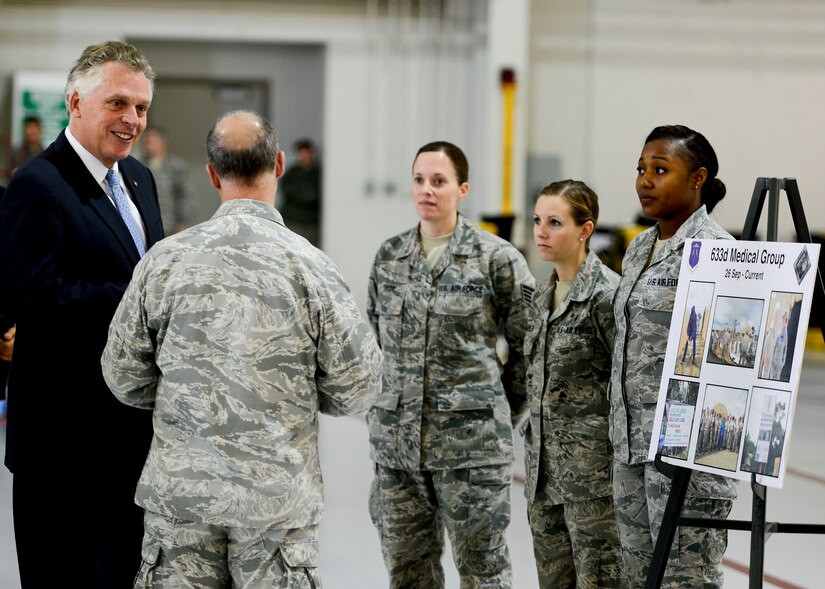 Virginia Gov. Terry McAuliffe visits with U.S. Air Force Airmen from the 633rd Medical Group during a tour at Langley Air Force Base, Va., Dec. 2, 2014. The governor visited Joint Base Langley-Eustis gain a greater understanding of the major military installations in the Commonwealth of Virginia. (U.S. Air Force photo by Senior Airman Kayla Newman/Released)