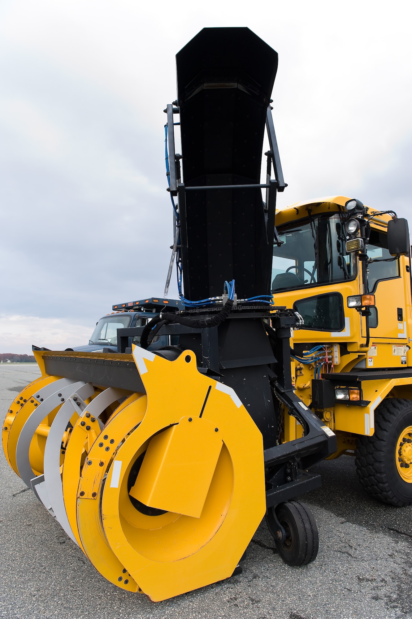 A snow blower sits ready to lead a variety of airfield snow removal vehicles down the flight line for the annual snow parade Nov. 6, 2014, on Dover Air Force Base, Del. Col. Michael Grismer, 436th Airlift Wing commander, drove the lead snow blower up and down the flight line under the guidance of Staff Sgt. Steve Kerr, 436th Civil Engineer Squadron Pavements and Construction Equipment operator.(U.S. Air Force photo by Roland Balik)