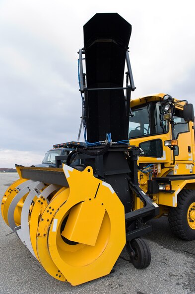 A snow blower sits ready to lead a variety of airfield snow removal vehicles down the flight line for the annual snow parade Nov. 6, 2014, on Dover Air Force Base, Del. Col. Michael Grismer, 436th Airlift Wing commander, drove the lead snow blower up and down the flight line under the guidance of Staff Sgt. Steve Kerr, 436th Civil Engineer Squadron Pavements and Construction Equipment operator.(U.S. Air Force photo by Roland Balik)
