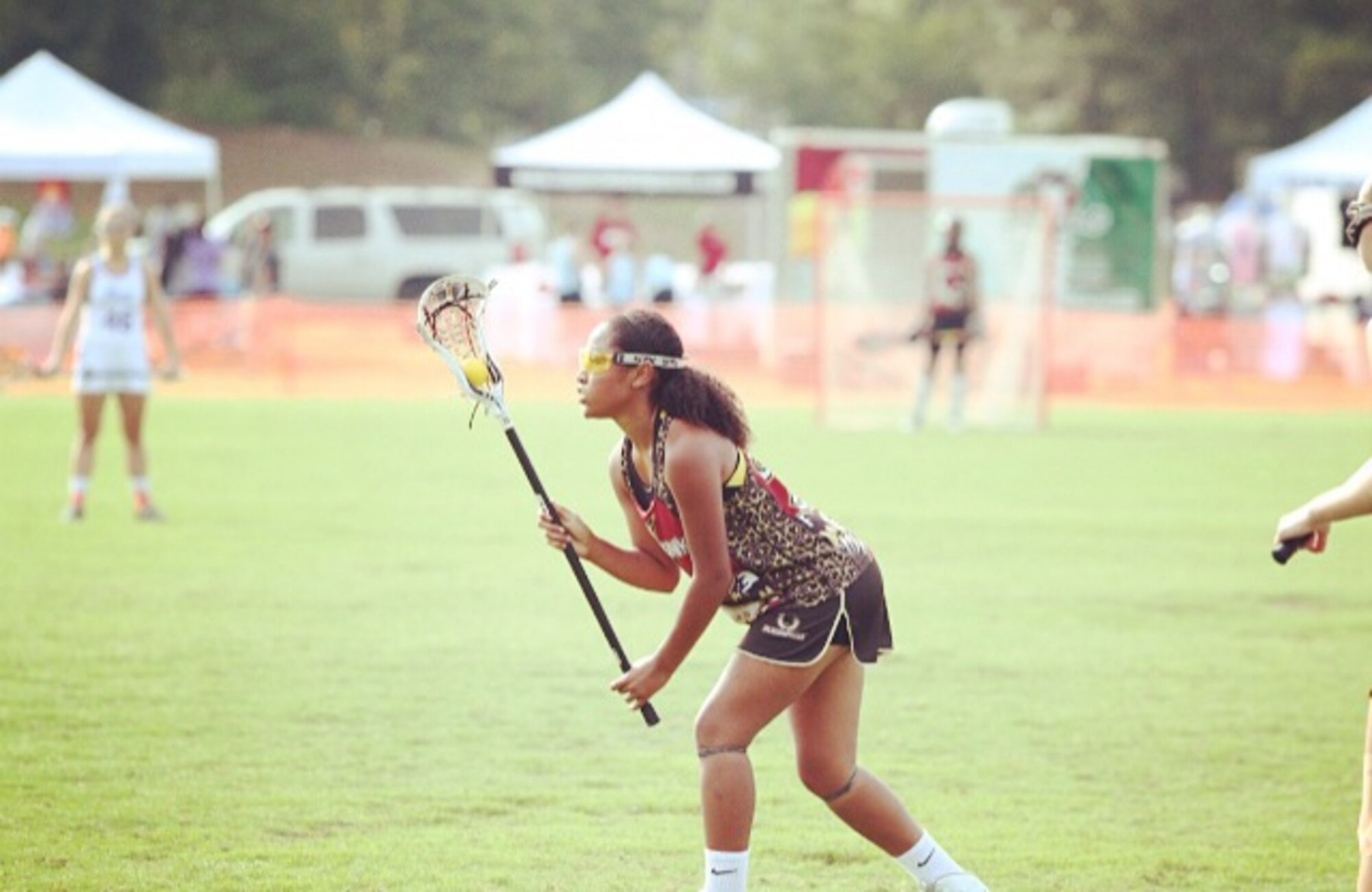 Amya Hudson, daughter of Maj. Quincy Hudson, scans the field during a lacrosse game in Georgia, Oct. 10, 2014. Amya signed on to play lacrosse for the Navy Academy. (U.S. Air Force courtesy photo/Released)
