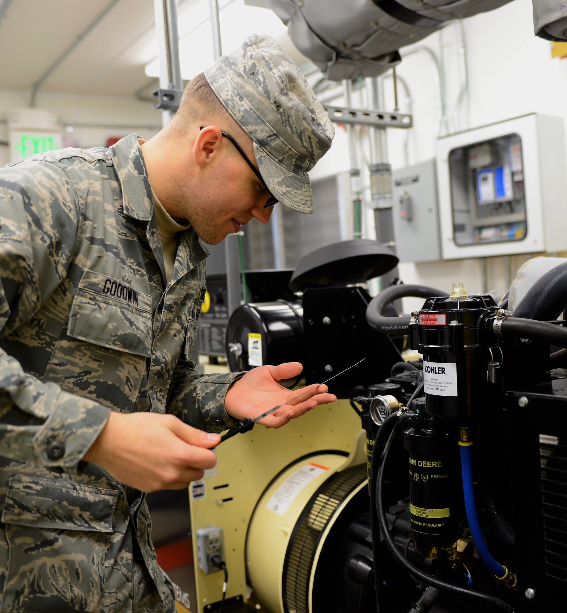 U.S. Air Force Airman 1st Class Justin Goodwin, a 52nd Civil Engineer Squadron electrical power production journeyman, checks the oil of the emergency generator for a Digital Airport Surveillance Radar at Spangdahlem Air Base, Germany, Nov. 25, 2014. The generator provides power to the DASR system when the primary source fails and ensures the base still receives critical information that assists in aircraft operations. (U.S. Air Force photo illustration by Airman 1st Class Luke Kitterman/Released)
 
