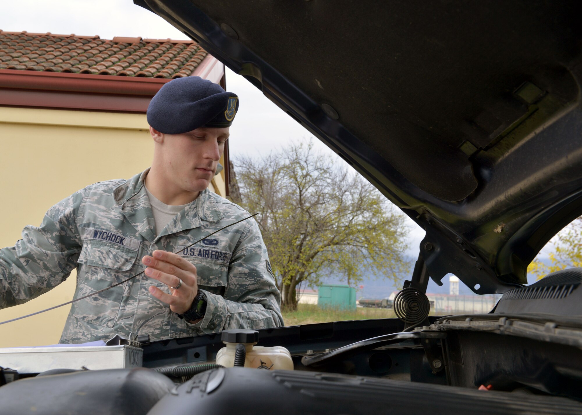 Airman 1st Class Michael Wychcock, 31st Security Forces Squadron assistant vehicle control officer, checks the oil on a security forces patrol truck, Dec. 12, 2014, at Aviano Air Base, Italy. Wychock is are in charge of vehicle inspections, end of month mileage checks and setting up contracts for lights, radios, public addressing systems and weapons racks for security forces vehicles. (U.S. Air Force photo/Airman 1st Class Ryan Conroy) 