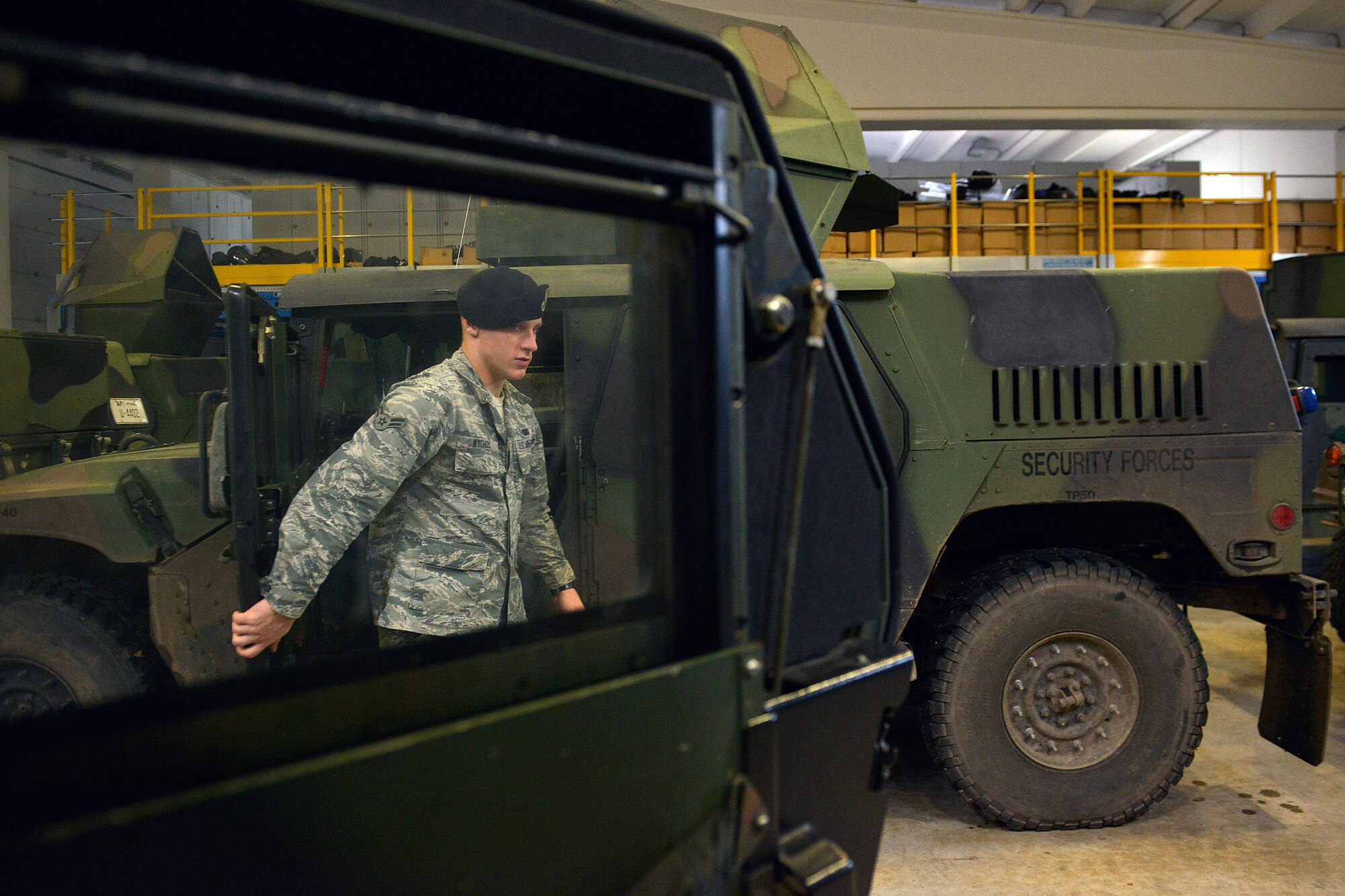 Airman 1st Class Michael Wychcock, 31st Security Forces Squadron assistant vehicle control officer, conducts an inspection on a Humvee, Dec. 12, 2014, at Aviano Air Base, Italy. The 31 SFS fleet is the largest in the U.S. Air Forces in Europe and Air Forces in Africa with more than 80 vehicles. (U.S. Air Force photo/Airman 1st Class Ryan Conroy) 