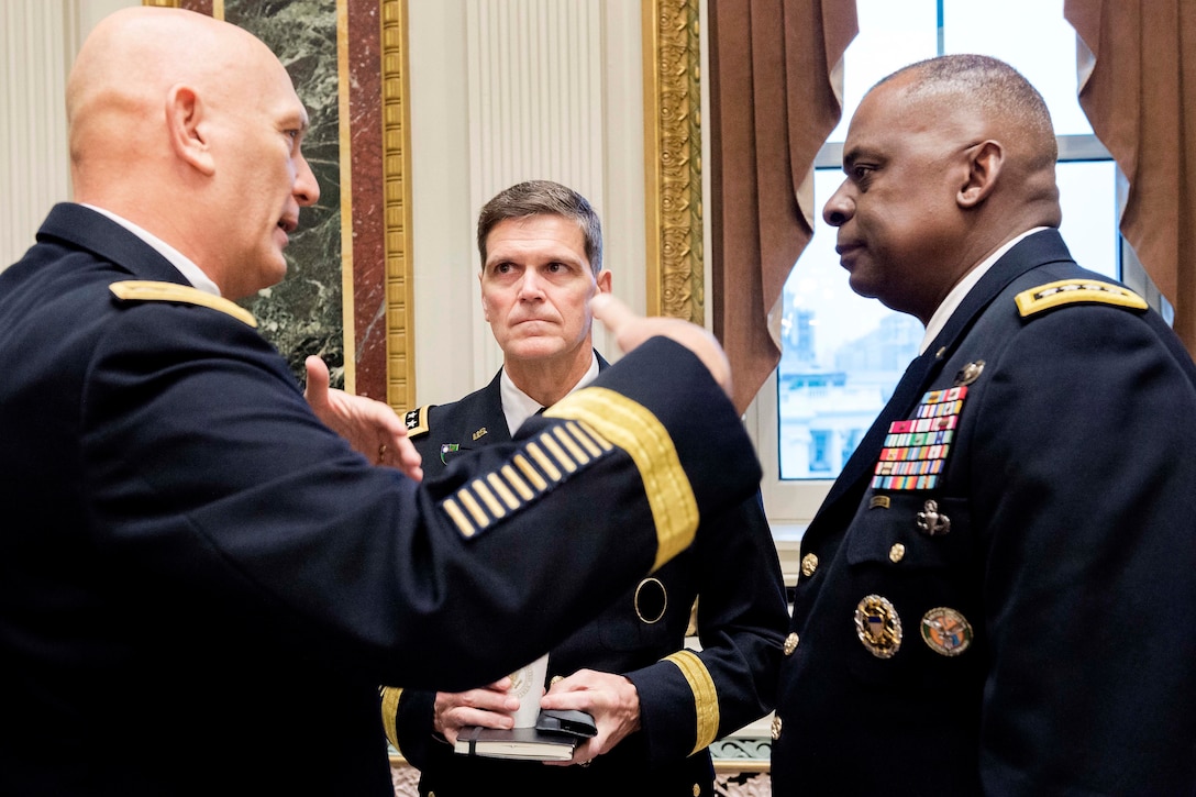 Army Chief of Staff Gen. Ray Odierno, left, Army Gen. Joseph L. Votel III, commander, U.S. Special Operations Command and Army Gen. Lloyd Austin, commander, U.S. Central Command, speak during a strategic studies seminar at the Eisenhower Executive Office Building in Washington D.C., Dec. 2, 2014.