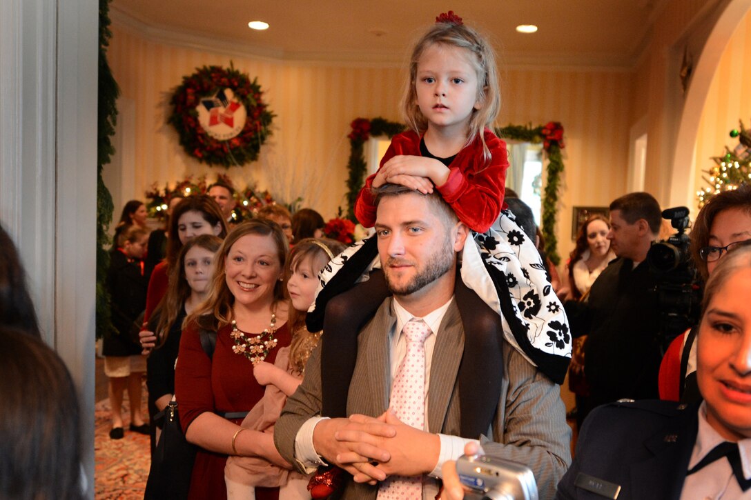 Military service members and their families listen as Dr. Jill Biden, wife of Vice President Joe Biden, speaks during a holiday reception she hosted at the vice president's residence in Washington, D.C., Dec. 3, 2014.