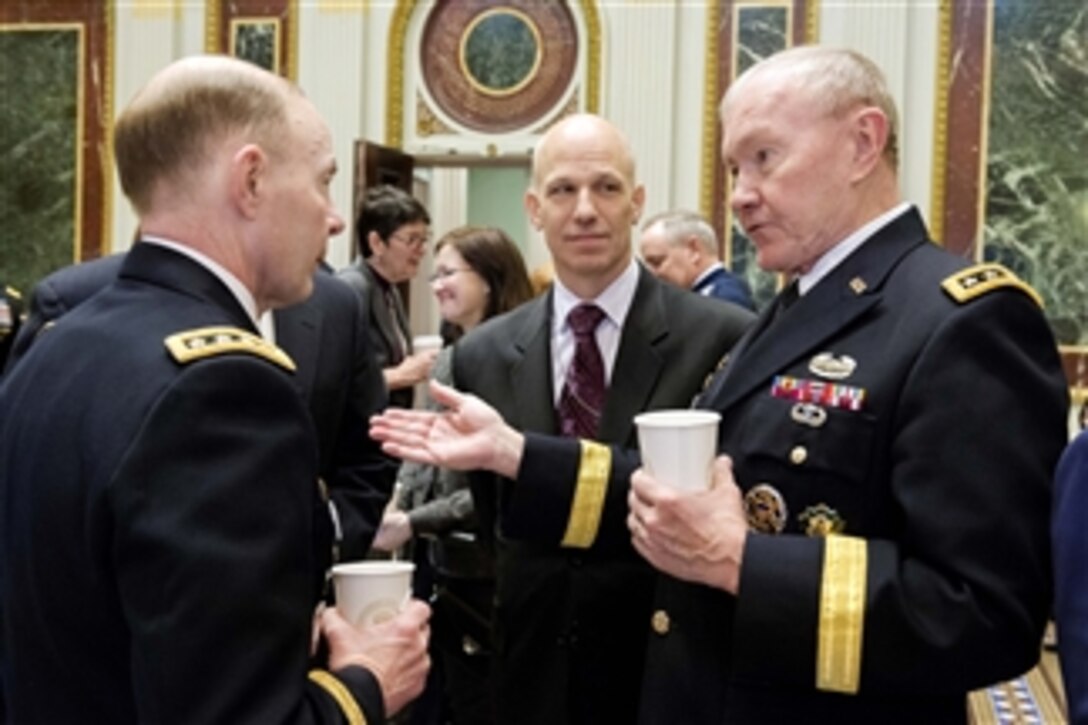 Army Gen. Martin E. Dempsey, right, chairman of the Joints Chiefs of Staff, speaks with Army Gen. Charles H. Jacoby Jr., left, commander of U.S. Northern Command and North American Aerospace Defense Command, and James H. Baker, the chairman’s strategist, during a strategic studies seminar at the Eisenhower Executive Office Building in Washington D.C., Dec. 2, 2014.
