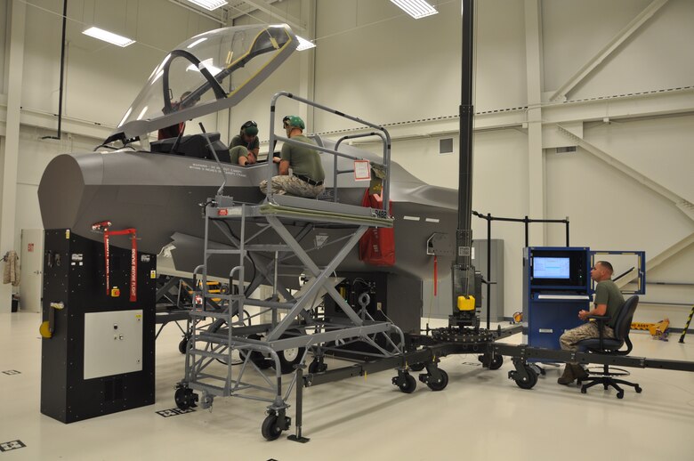 U.S. Marine Corps F-35 Lightning II maintainer students train at the ejection seat maintenance trainer at the 33rd Fighter Wing’s F-35 Academic Training Center on Eglin Air Force Base, Fla., Sept. 9, 2012. The pilot and maintainer qualifications are accomplished through simulations to ensure efficient mission readiness. As the first of its kind in the Department of Defense, the wing is responsible for F-35 Lightning II pilot and maintainer training for the DOD and, in the future, at least eight coalition partners. (U.S. Air Force courtesy photo)