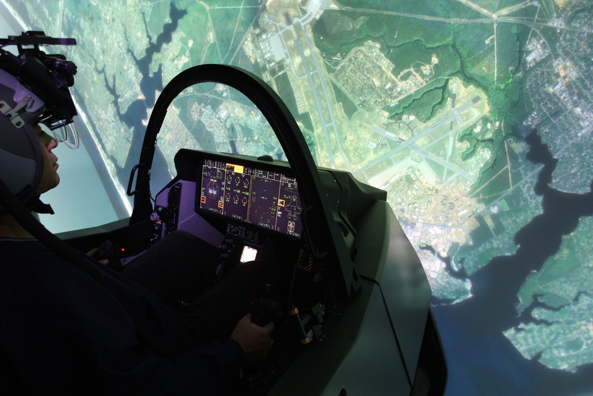 An Airman practices on an F-35 Lightning II full mission simulator at the 33rd Fighter Wing’s F-35 Academic Training Center on Eglin Air Force Base, Fla., Nov. 22, 2013. The pilot and maintainer qualifications are accomplished through simulations to ensure efficient mission readiness. As the first of its kind in the Department of Defense, the wing is responsible for F-35 Lightning II pilot and maintainer training for the DOD and, in the future, at least eight coalition partners. (U.S. Air Force courtesy photo)
