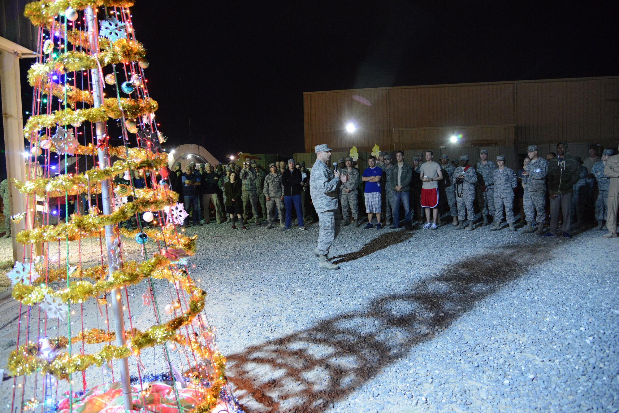 SOUTHWEST ASIA - Col. Jason Hanover, 386th Air Expeditionary Wing commander, talks about the importance of the holidays following the holiday lighting ceremony here Dec. 3, 2014. Following the lighting, music and treats were available to help Marauders usher in the holiday season. (U.S. Air Force photo by Tech. Sgt. Jared Marquis/released)