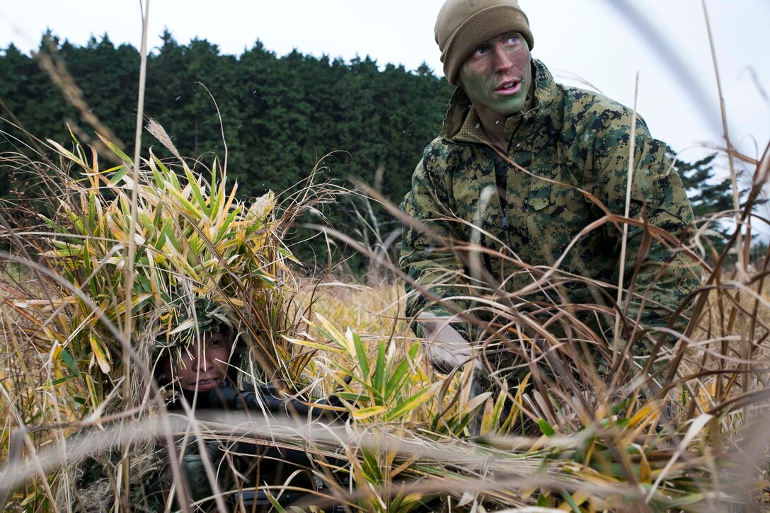 U.S. Marine Lance Cpl. Jonas G. Dewald, right, instructs a Japan Ground Self-Defense Force member during sniper stalk lane training Dec. 2 in the Oyanohara Training Area in Yamato, Kumamoto prefecture, Japan. The training is part of Forest Light 15-1, a semi-annual, bilateral exercise consisting of a command post exercise and field training events conducted by elements of III Marine Expeditionary Force and the JGSDF to enhance the U.S. and Japan military partnership, solidify regional security agreements and improve individual and unit-level skills. Dewald, from Wilson, North Carolina, is a machine gunner with Weapons Company, 2nd Battalion, 9th Marine Regiment, currently attached to 4th Marine Regiment, 3rd Marine Division, III MEF, under the unit deployment program. The JGSDF member is with 42nd Regiment, 8th Division, Western Army, JGSDF. 