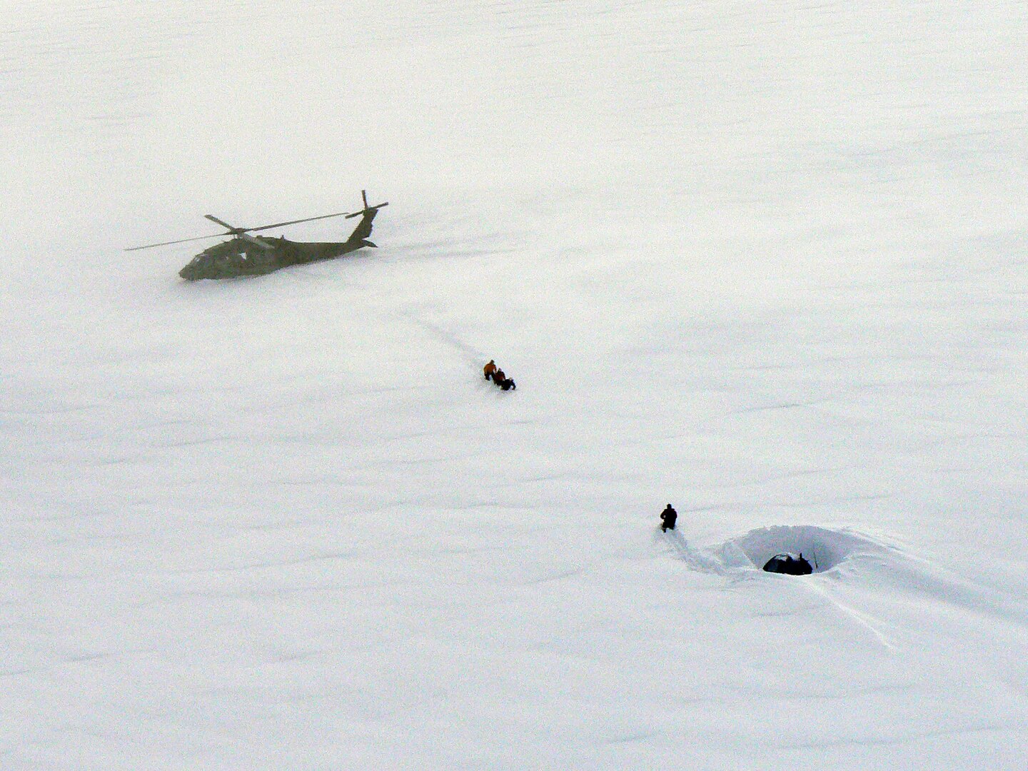 An Alaska Army National Guard UH-60 Blackhawk helicopter sits on Meade
Glacier while Juneau and Douglas mountain rescue teams aid a hiker stranded since March 7, 2010. Army Guard and Coast Guard crews were finally able to reach the hikers location after four unsuccessful Coast Guard attempts due to dense fog and various weather conditions. Alaska State Troopers estimated the area he was stranded in has received 12 feet of snow since Feb. 20.