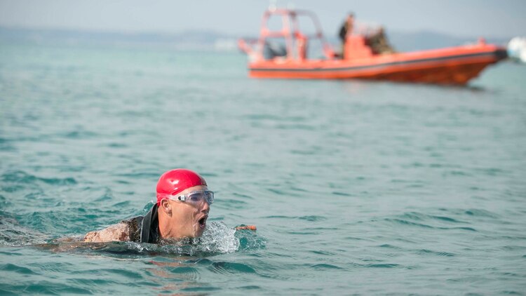 Lance Cpl. Myles R. Merchant, from Elberna, Alabama, swims two kilometers during the scout swimmers course Nov. 5 at the White Beach Naval Facility. The Marines had to swim 2 kilometers in under an hour as one of their evaluations during the course. Merchant is a student of the course with Expeditionary Operations Training Group, III Marine Expeditionary Force Headquarters Group, III MEF. 