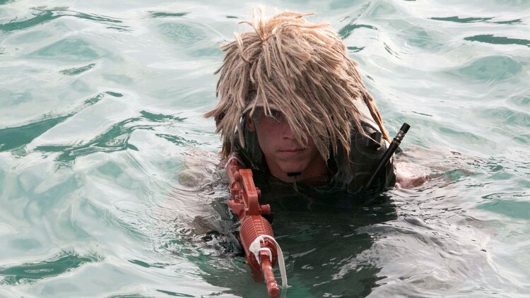 Sgt. Christopher Rateau-Holbach, from Fulton, Mississippi, swims towards his destination Oct. 30 at White Beach Naval Facility during the scout swimmers course. The students underwent countless hours in the water in order to become more proficient in maneuvering through the water. Rateau-Holbach is a student with Expeditionary Operations Training Group, III Marine Expeditionary Force Headquarters Group, III MEF.