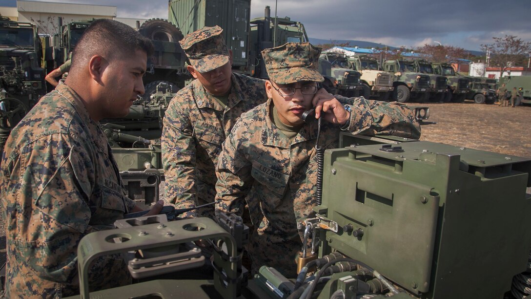 Sgt. Johnathan F. Alcantar, left, Lance Cpl. Axel R. Lozano, right, and Staff Sgt. Rodney P. Agustin determine the GPS location of an M777A2 lightweight 155 mm howitzer during an exercise for Artillery Relocation Training Program 14-3 Oct. 30 at Camp Fuji. ARTP was established to provide artillery units the opportunity to train with live ammunition and sustain combat readiness. The Marines are with Battery I, 3rd Battalion, 11th Marine Regiment, 1st Marine Division, based out of Twentynine Palms, California, and currently assigned to 3rd Bn., 12th Marine Regiment, 3rd Marine Division, III Marine Expeditionary Force, under the unit deployment program. 