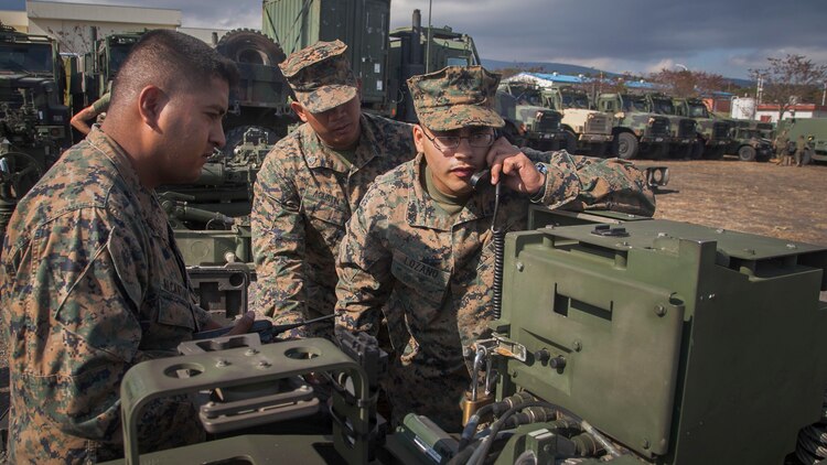 Sgt. Johnathan F. Alcantar, left, Lance Cpl. Axel R. Lozano, right, and Staff Sgt. Rodney P. Agustin determine the GPS location of an M777A2 lightweight 155 mm howitzer during an exercise for Artillery Relocation Training Program 14-3 Oct. 30 at Camp Fuji. ARTP was established to provide artillery units the opportunity to train with live ammunition and sustain combat readiness. The Marines are with Battery I, 3rd Battalion, 11th Marine Regiment, 1st Marine Division, based out of Twentynine Palms, California, and currently assigned to 3rd Bn., 12th Marine Regiment, 3rd Marine Division, III Marine Expeditionary Force, under the unit deployment program. 