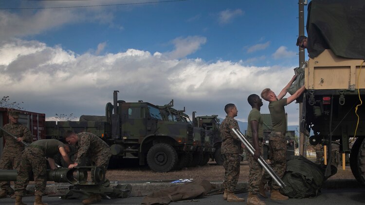 Marines unload a 7-ton truck Oct. 30 during a command post exercise for Artillery Relocation Training Program 14-3 at Camp Fuji. The Marines are with Battery B, 1st Battalion, 12th Marine Regiment, 1st Marine Division, based out of Kaneohe Bay, Hawaii, and are currently assigned to 3rd Bn., 12th Marines, 3rd Marine Division, III Marine Expeditionary Force under the unit deployment program. 