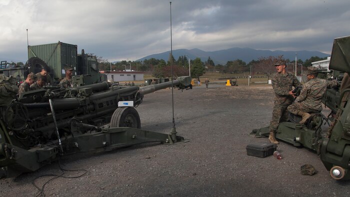 Marines check the GPS coordinates of their M777A2 lightweight 155 mm howitzers Oct. 30 during a command post exercise for Artillery Relocation Training Program 14-3. “Camp Fuji provides that cold weather training environment that artillery units need to be familiar with,” said Sgt. Maj. Marvin M. Magcale, the battalion sergeant major for 3rd Battalion, 12th Marines. “The Marines and sailors in this battalion will be better prepared to accomplish the mission involving cold weather. Austere conditions obviously affect not only the Marines and sailors, but their equipment as well.” The Marines are with Battery B, 1st Bn., 12th Marine Regiment, 1st Marine Division, based out of Kaneohe Bay, Hawaii, and are currently assigned to 3rd Bn., 12th Marines, 3rd Marine Division, III Marine Expeditionary Force under the unit deployment program.