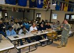 Army Staff Sgt. Ken Fodrie of the Indiana National Guard teaches an emergency-aid class to Defense Department civilians at the Camp Atterbury Joint Maneuver Training Center in central Indiana, March 3, 2010. The class is part of a five-day course designed to mobilize the civilians to deploy to Iraq.