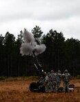 New York Army National Guard Soldiers from Alpha Battery, 1st Battalion, 258th Field Artillery Regiment's Gun Three team fire a high-explosive round from their M119A2 howitzer during the unit's gun crew qualification March 12 on Camp Blanding, Florida.