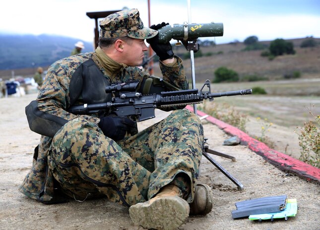 Sgt. Jerrod Campbell, an engineer with Combat Logistics Battalion 1, 1st Marine Logistics Group, sights in on his target during the Commanding General's Cup Rifle and Pistol matches at range 214, Dec. 4.(Photos by Lance Cpl. Asia J. Sorenson/Released)
