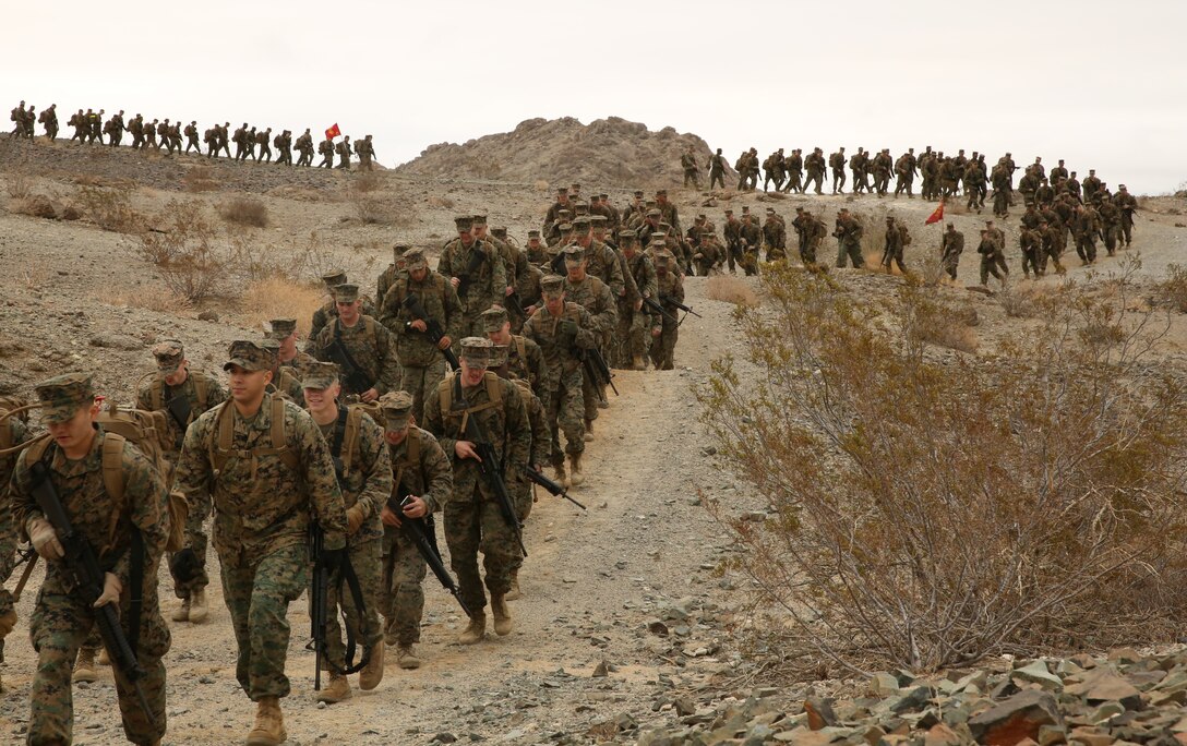 Non-Commissioned Officers of Headquarters Battalion participate in a hike aboard the Combat Center, led by Sgt. Maj. Abel Leal, battalion sergeant major, Dec. 3, 2014. NCOs from companies A, B, and C participated in the hike. (Official Marine Corps photo by Lance Cpl. Thomas Mudd/Released)