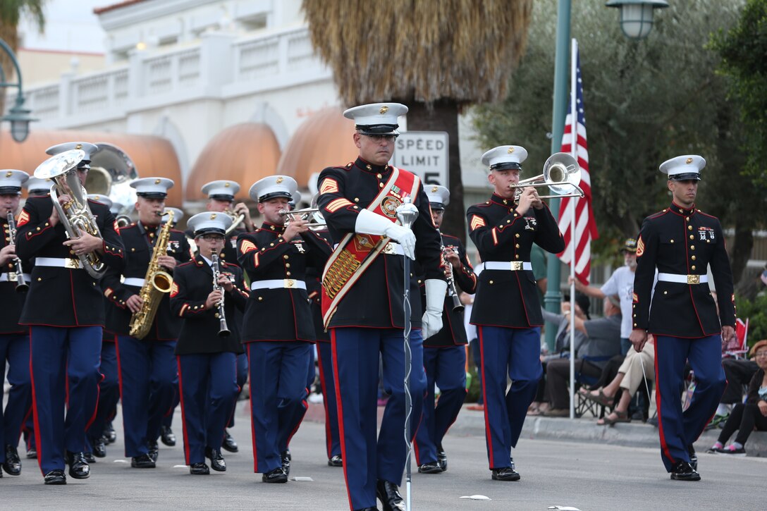 Gunnery Sgt. James Wallace, drum major, 3rd Marine Air Wing band, maintains the beat of his band during their performance at the Veterans Day Parade in Palm Springs, Calif., Nov. 11, 2014. Marine Corps Air Station Miramar provided the 3rd MAW Band for the parade. (Official Marine Corps photo by Lance Cpl. Julio McGraw/Released)