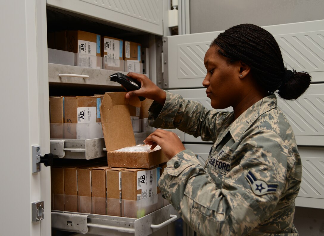 U.S. Air Force Airman 1st Class Jolonda Houston, 379th Expeditionary Medical Group Blood Transshipment Center medical logistician, checks the temperature of blood products, Dec. 4, 2014, at Al Udeid Air Base, Qatar. The BTC Airmen are always standing by to ship blood products whenever, and to wherever, they are needed at any given time. The BTC can also ship emergency blood products anywhere in the U.S. Central Command’s Area of Responsibility in less than 12 hours. (U.S Air Force photo by Senior Airman Kia Atkins)