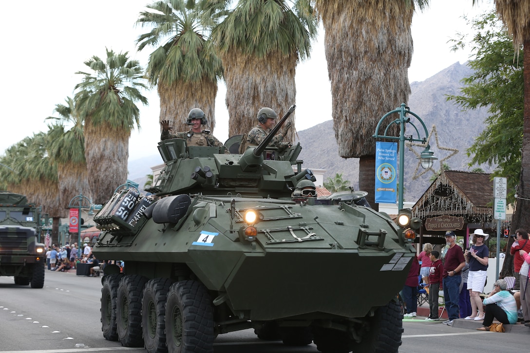 A Light Armored Vehicle 25 driven by Marines from 3rd light Armored Reconnaissance Battalion travels through the streets of Palm Springs, Calif., during the city’s Veterans Day Parade, Nov. 11, 2014. 3rd LAR provided military vehicle static displays for the parade. (Official Marine Corps photo by Lance Cpl. Julio McGraw/Released)