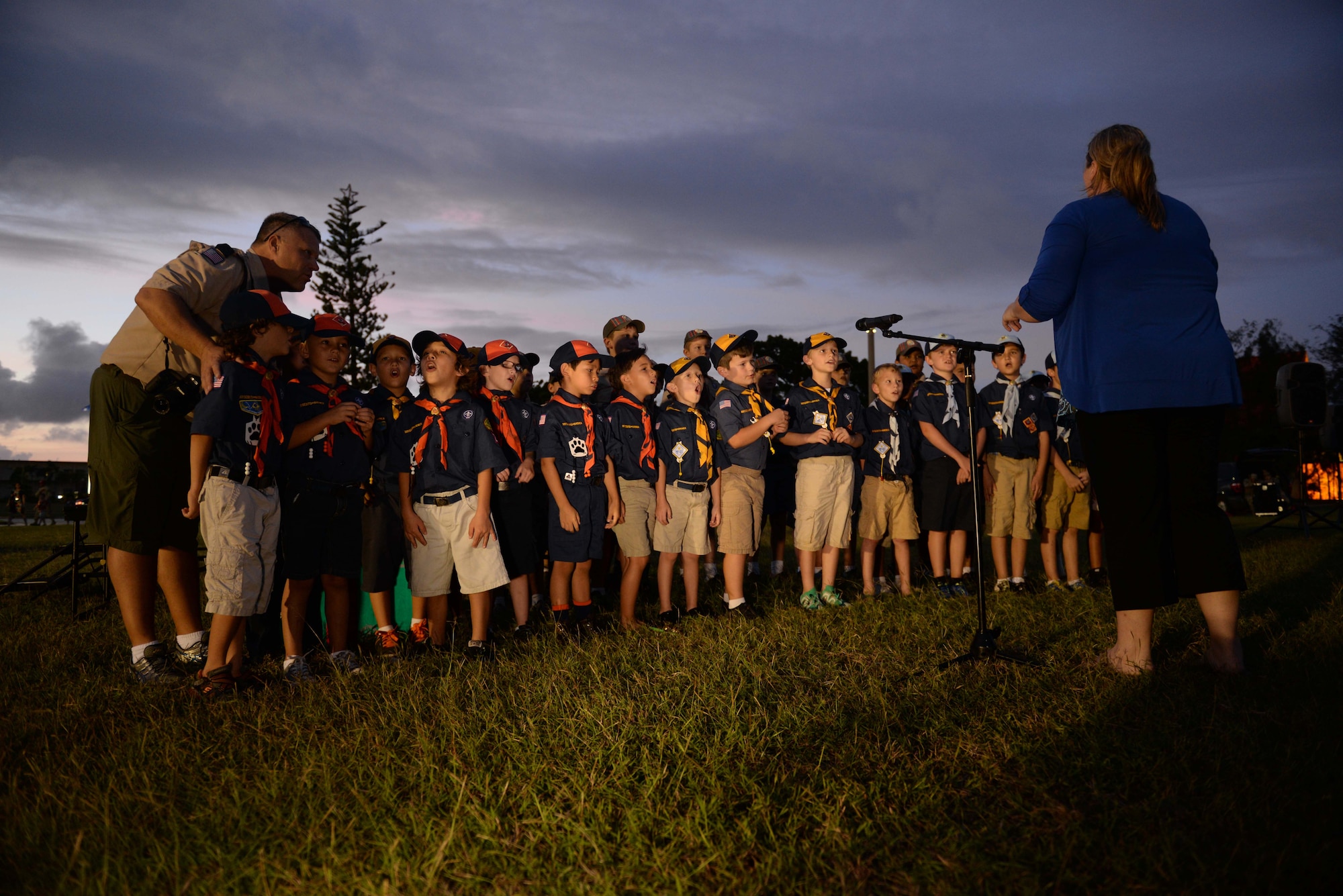Cub Scout Pack 20 sing holiday songs at the base tree lighting ceremony Dec. 2, 2014, at Andersen Air Force Base, Guam.  Andersen held the annual ceremony to bring families together during the holiday season. (U.S. Air Force photo by Airman 1st Class Amanda Morris/Released.) 