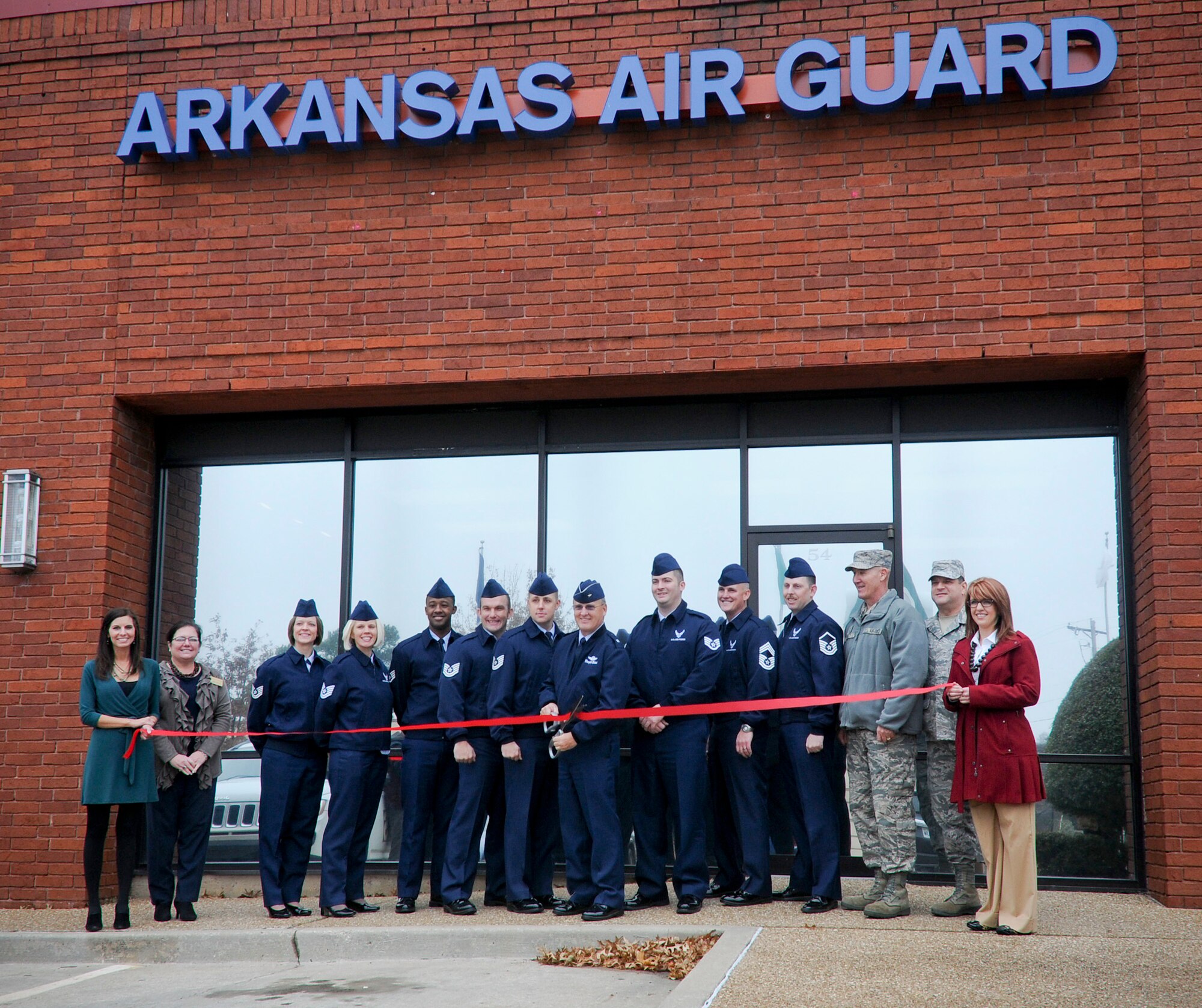 Brig. Gen. Travis D. “Dwight” Balch, chief of staff for the Arkansas Air National Guard, cuts the ceremonial ribbon Dec. 4, 2014, at the grand opening ceremony for the new Arkansas Air National Guard recruiting storefront at Green Point Shopping Center in Fort Smith, Ark. Air National Guard recruiting and retention representatives from locations in Little Rock, Fayetteville and Fort Smith, Ark. joined members of the Fort Smith Chamber of Commerce to commemorate the first off-base recruiting office in the 188th Wing’s history. (U.S. Air National Guard photo by Staff Sgt. Hannah Dickerson/released)
